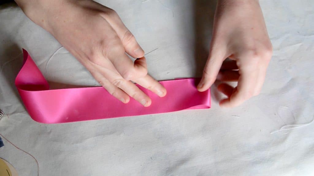 fold over the end of the ribbon