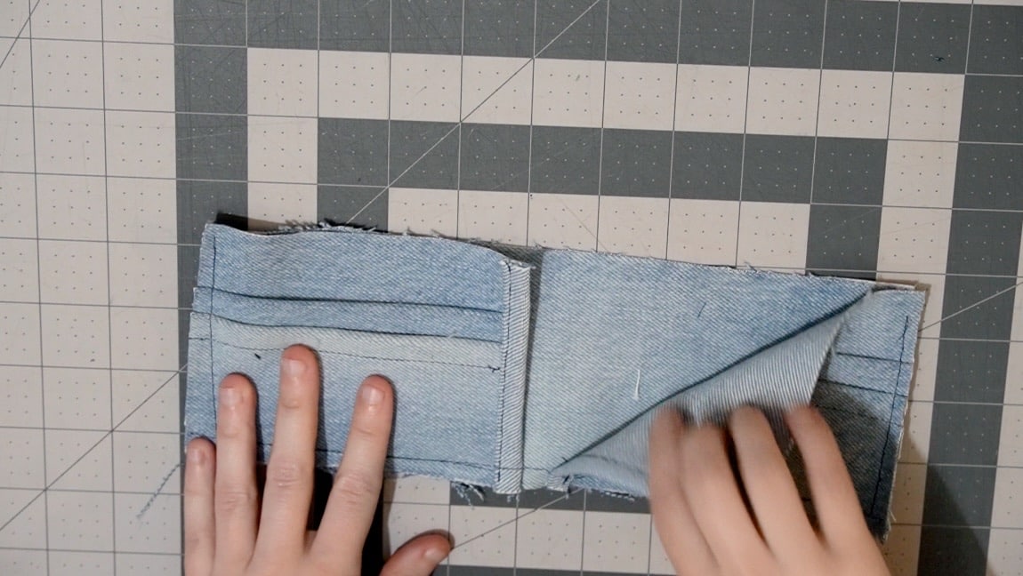 baste the side pocket pieces to the long inner pocket piece. baste around the side and bottom