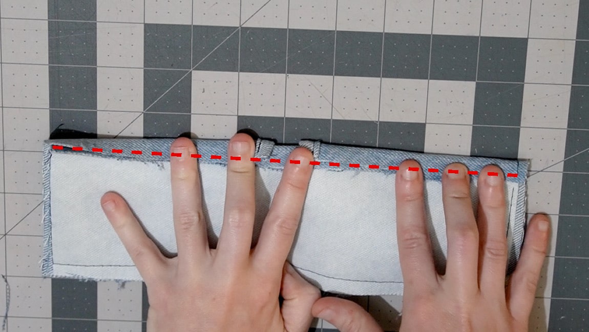 fold over the upper side of the pocket