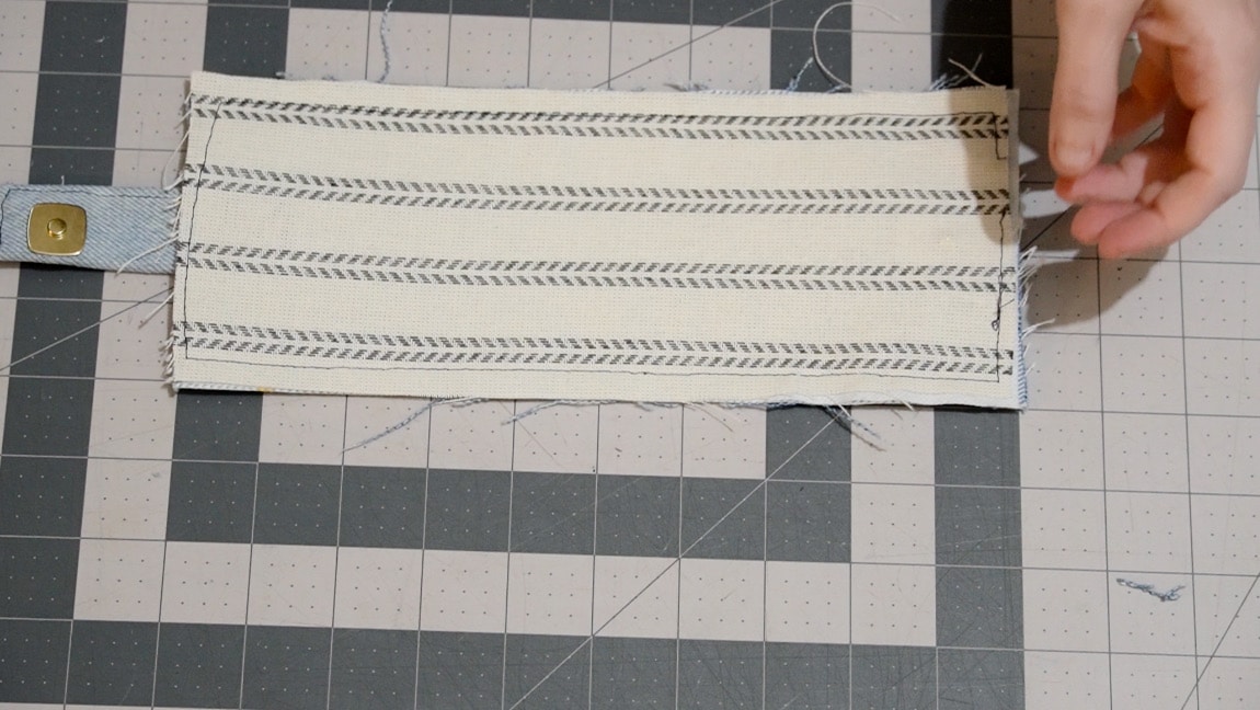 add wallet lining and baste around the perimeter, wrong sides together