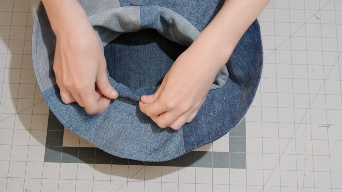 turn hat to right side, fold lining to sew up gap