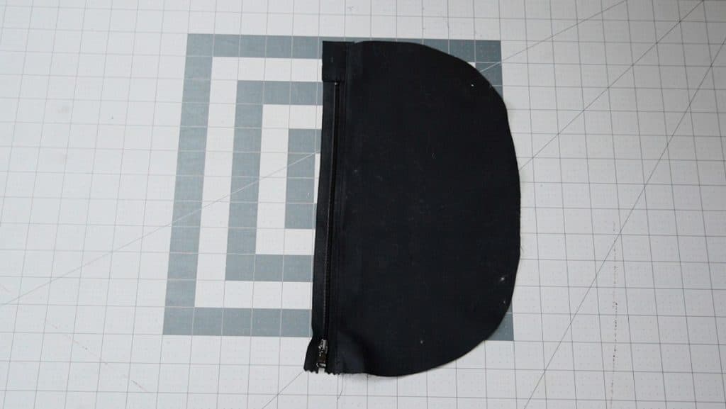 press zipper away from bag