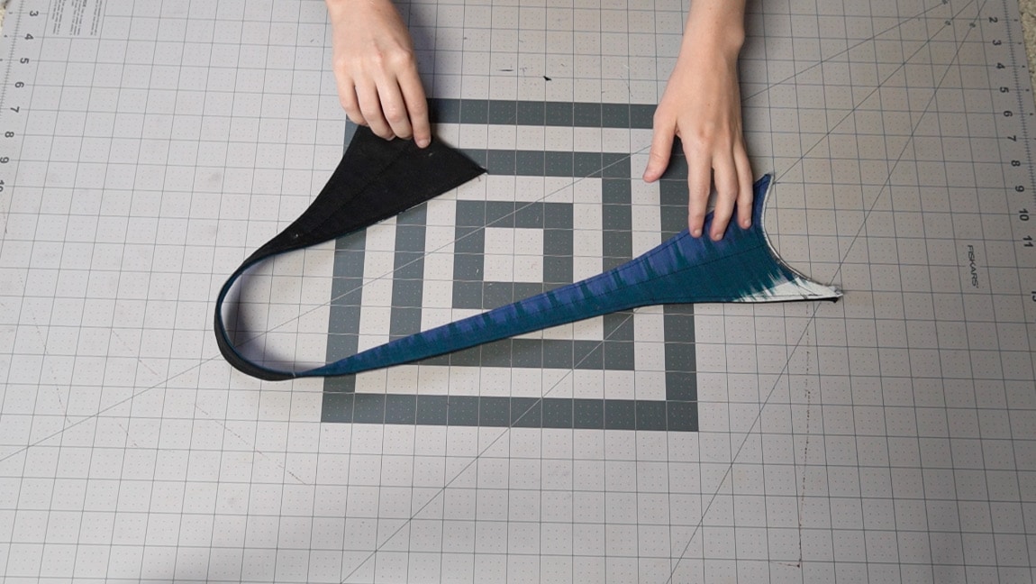 sew a line of stitches down the center of the strap