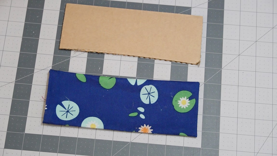 cut a piece of cardboard to fit in the base