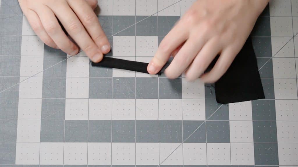 fold the tab in half and sew closed