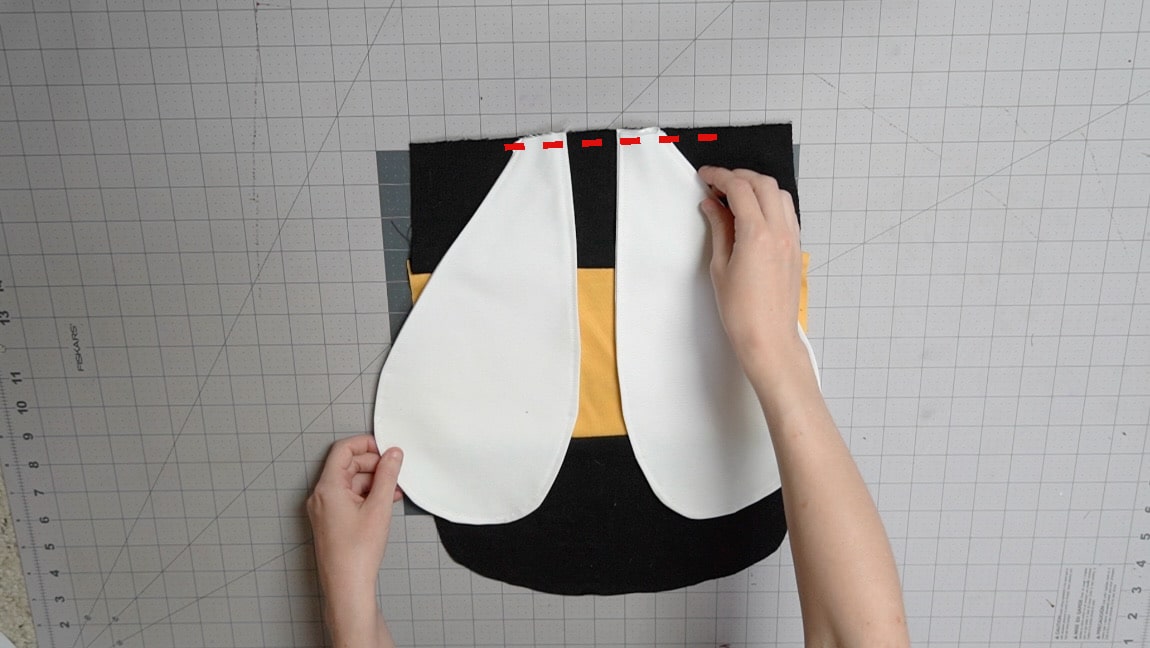 baste wings to top of bag