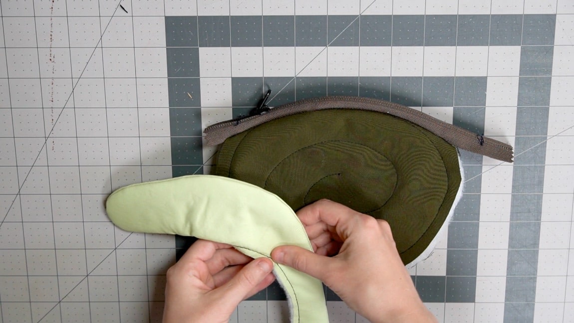 sew snail to one side of shell