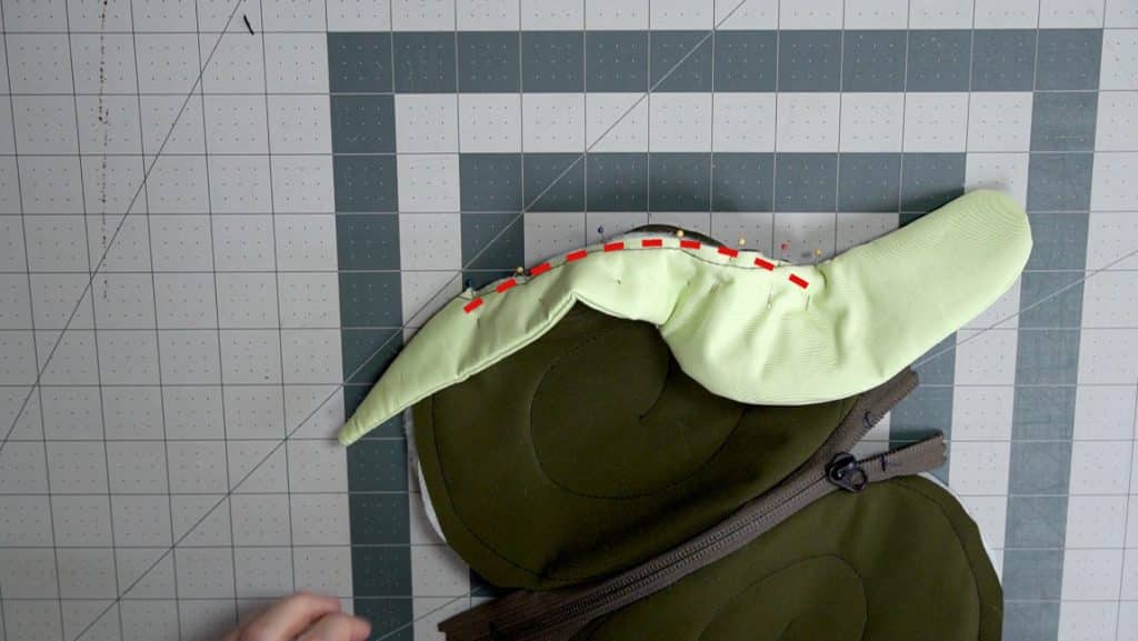 sew snail to one side of shell