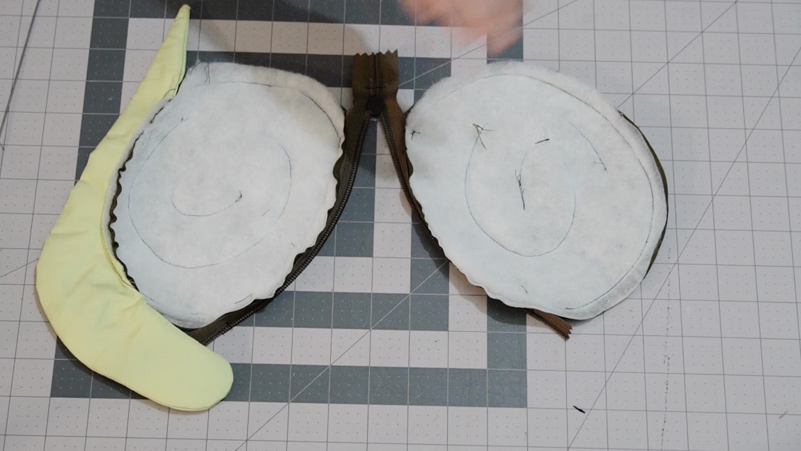 sew snail to one side of shell