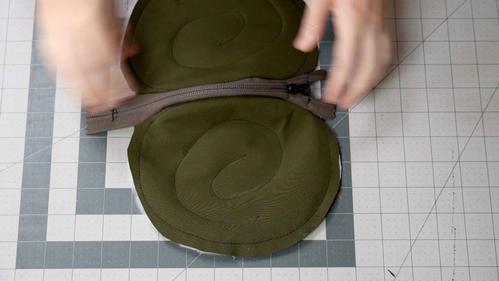 sew zipper face down on shell pieces