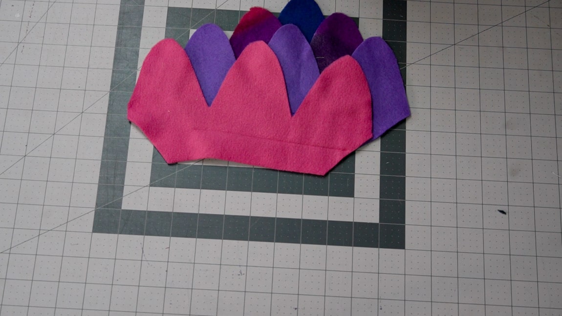 place next fleece piece 1 inch above, line up the side diagonal
