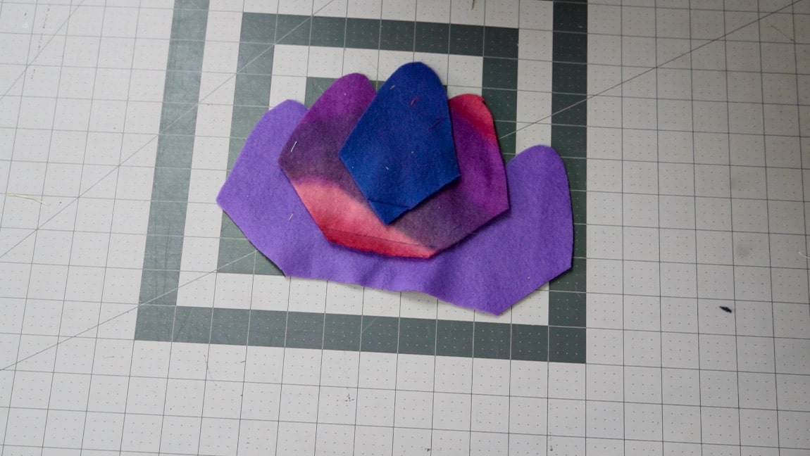 place third fleece piece 1 inch above second