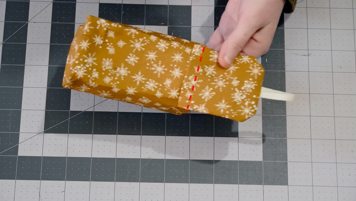 fold the top over the seam and sew close to the edge of the pouch