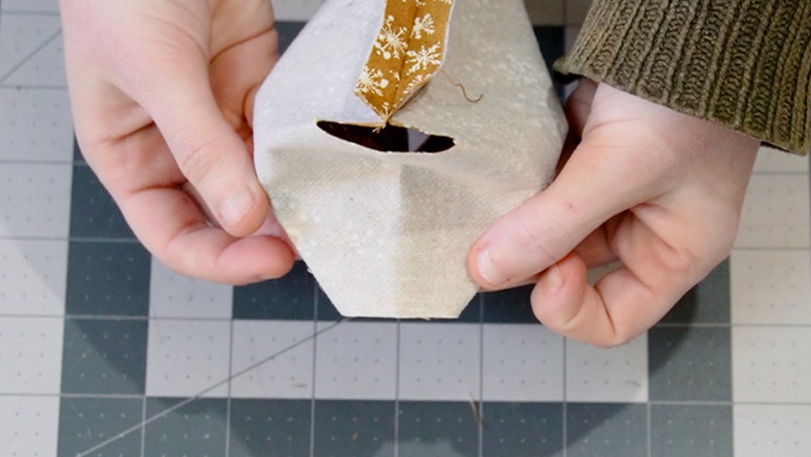 fold the corner together and sew