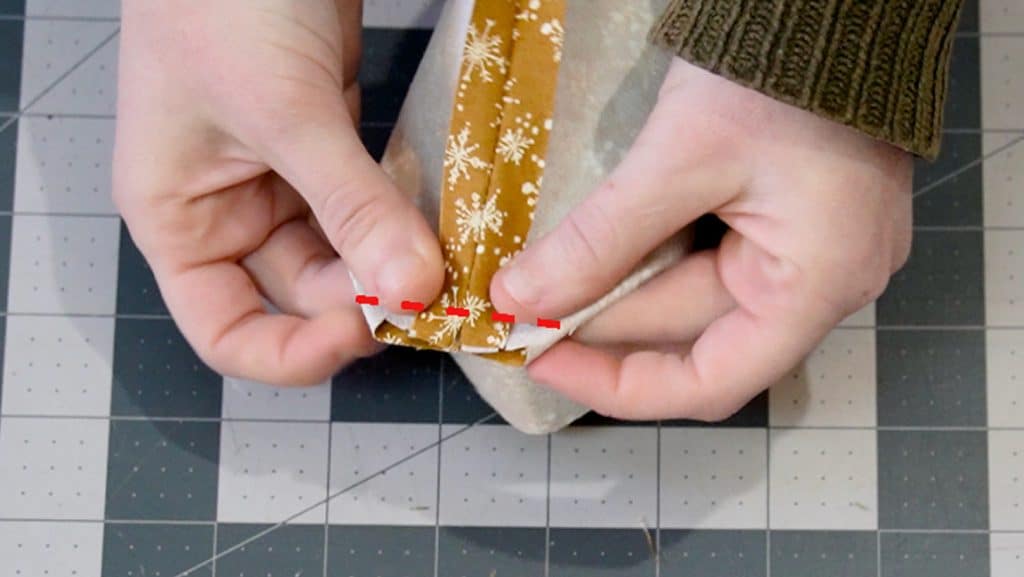 fold the corner together and sew