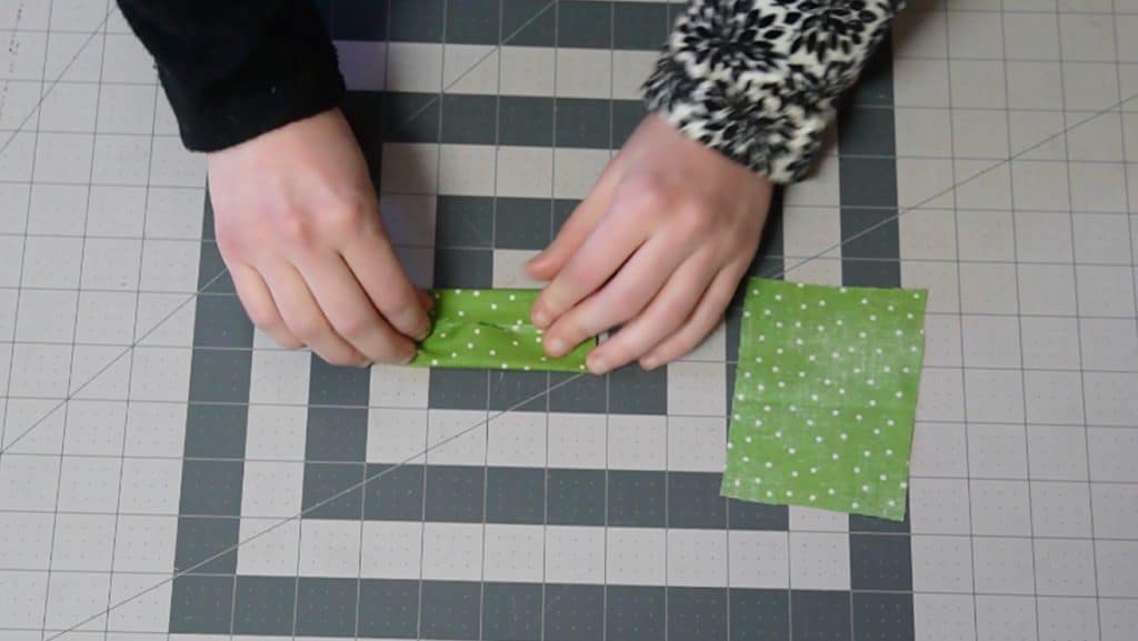 fold the tabs in quarters and sew along the edge