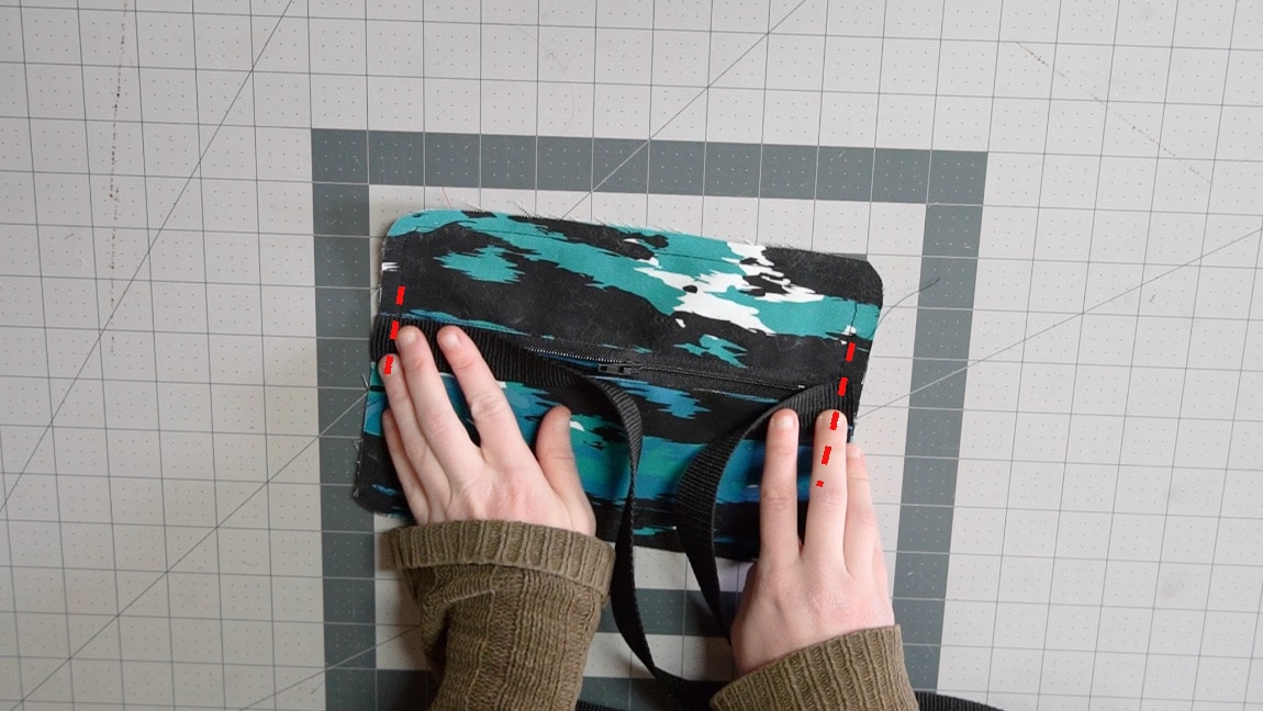 baste strap to both sides of pouch back