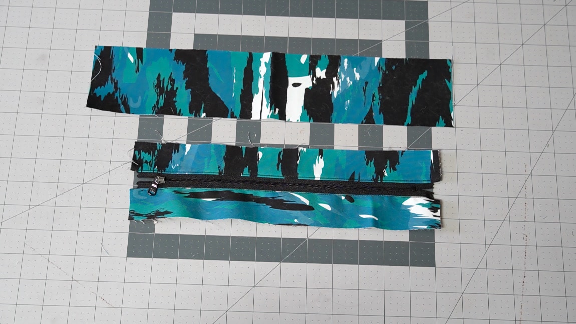 sew zipper side to pouch side/bottom