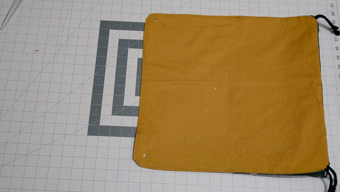 use an awl to poke a hole in both corners