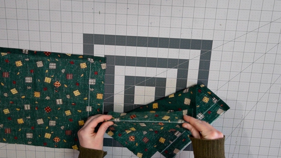 fold over and edgestitch the side stitchline of the pocket