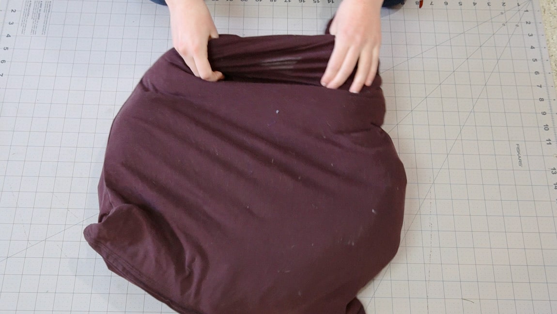 put the arms inside the shirt