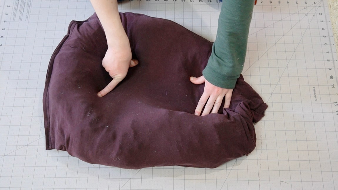 put the arms inside the shirt