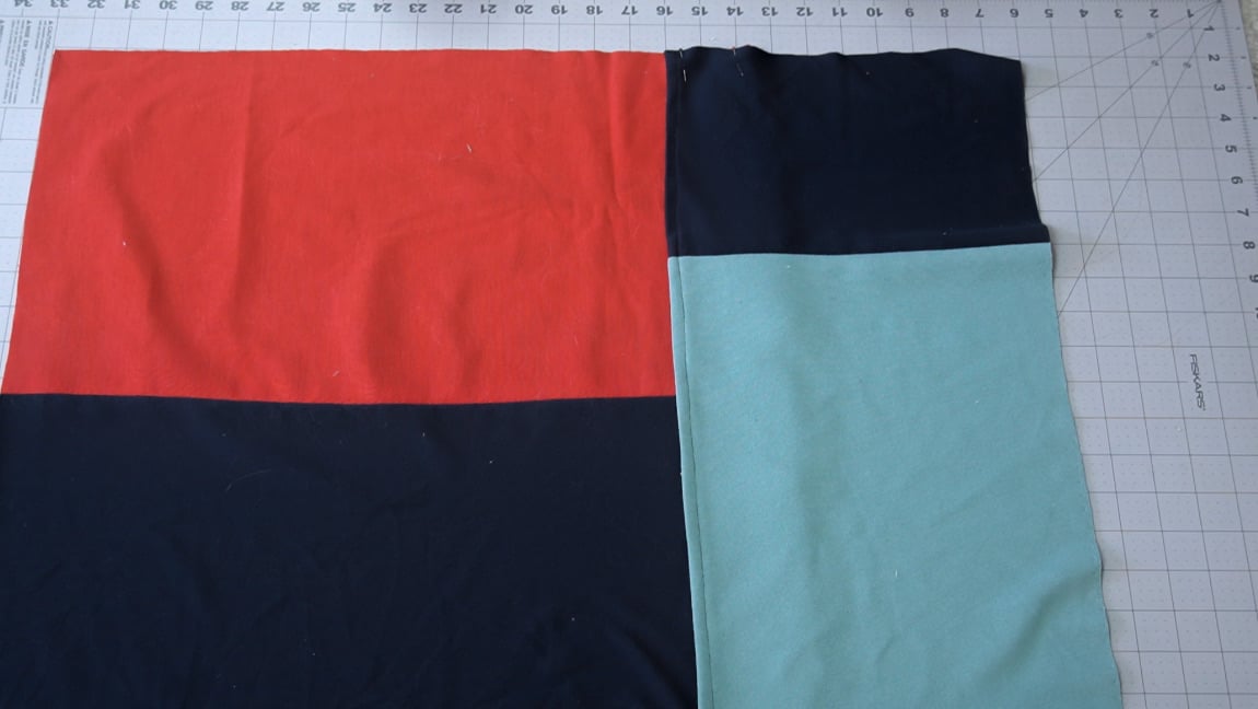 overlap the back pieces by 3 inches and baste together