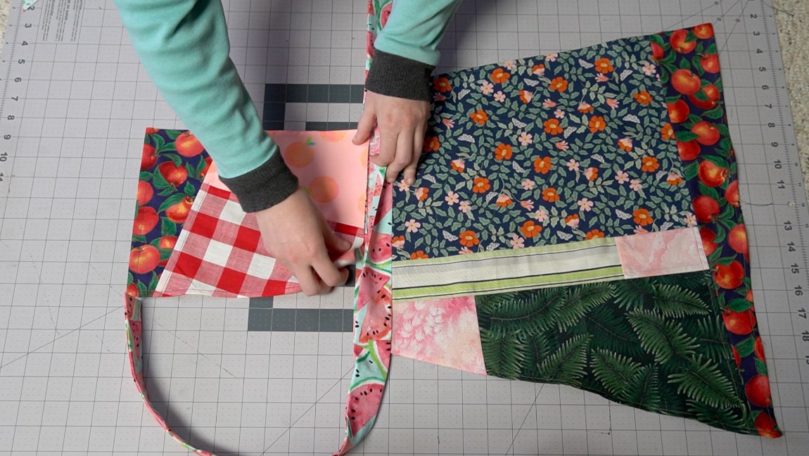 slide the bib into the waistband