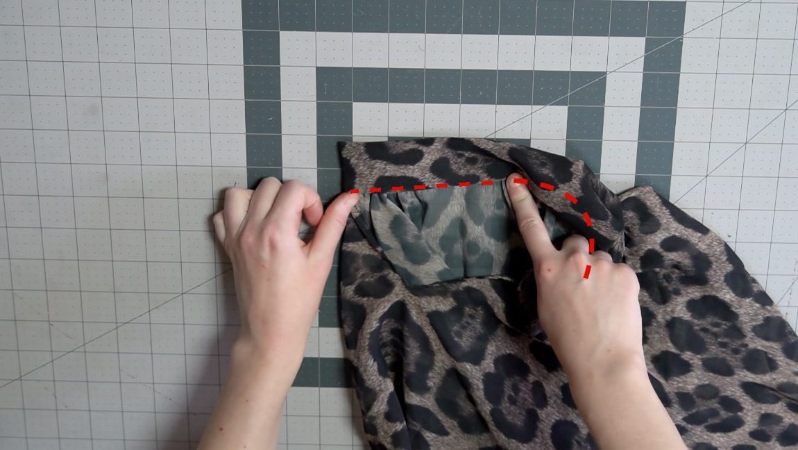 turn the neckband and fold the seam allowance under to sew in place
