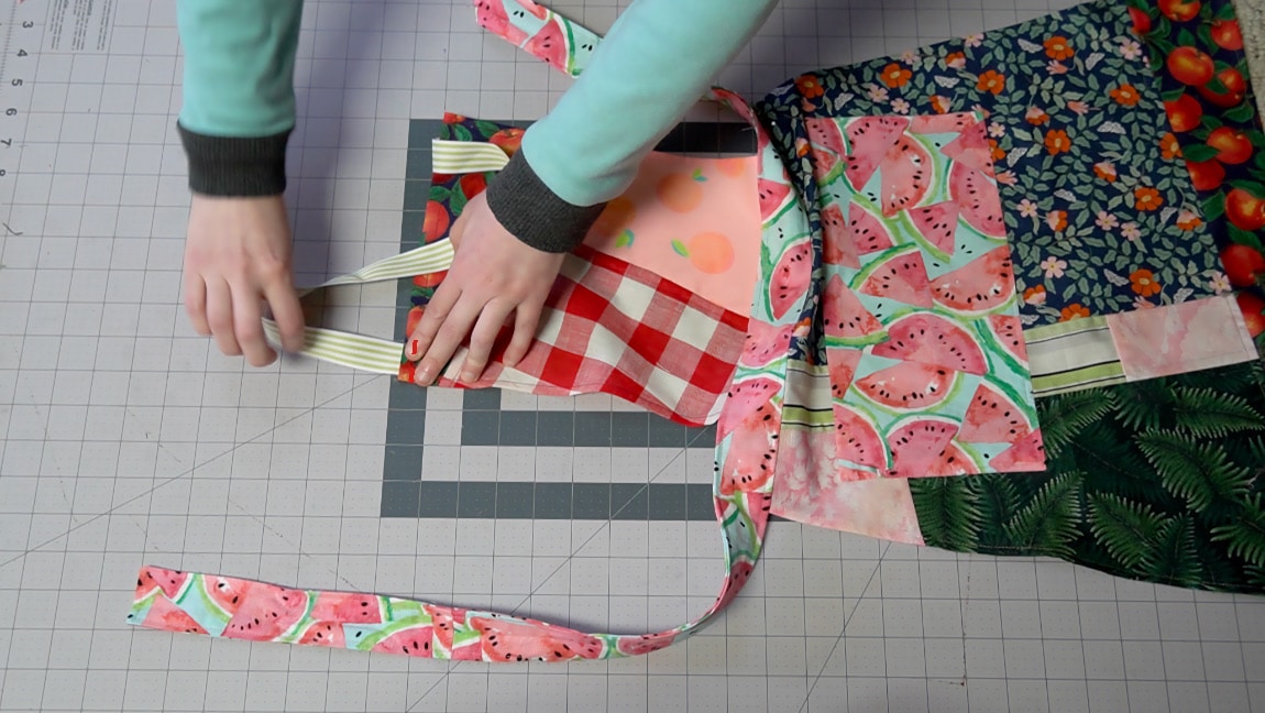 sew ribbon to the top of the apron
