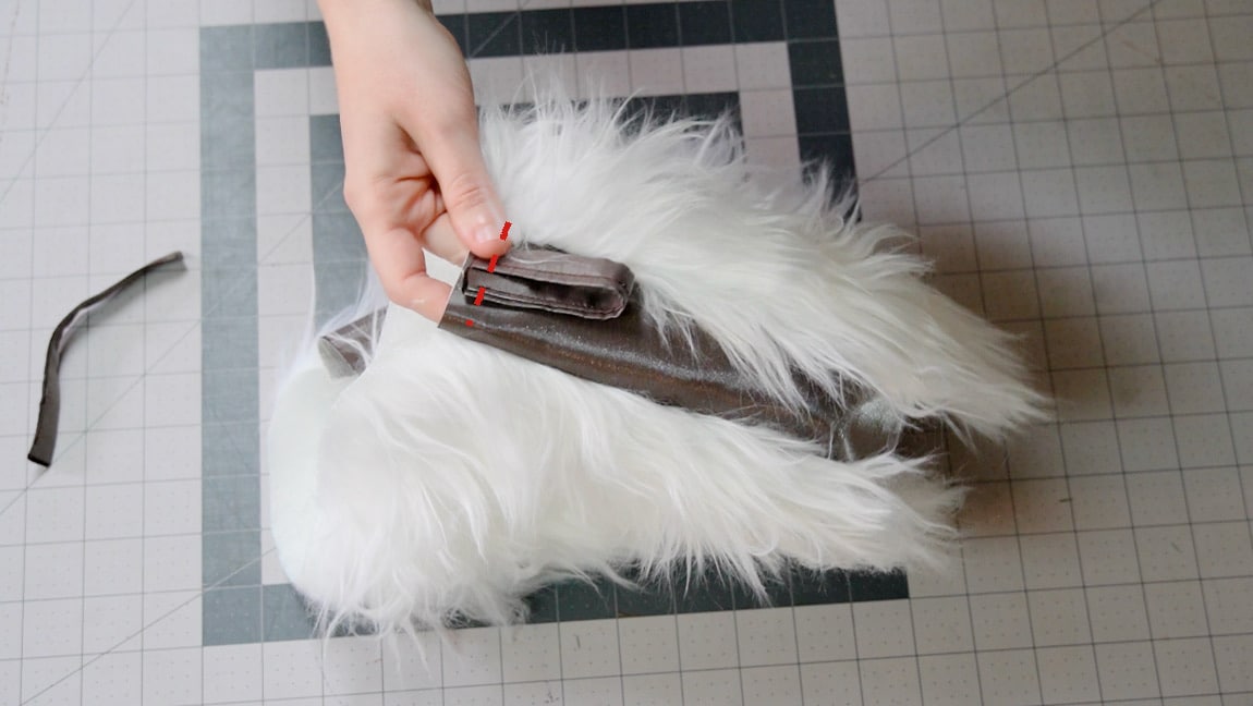 baste tabs to side bag