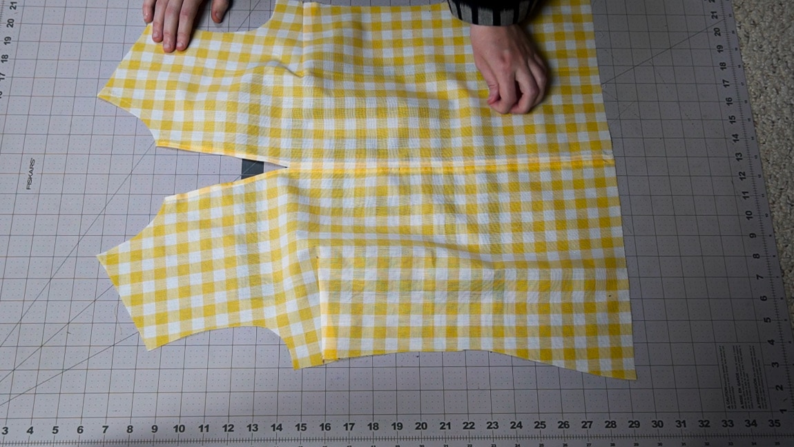 fold the seam allowance of the center front seam and hem the neckline
