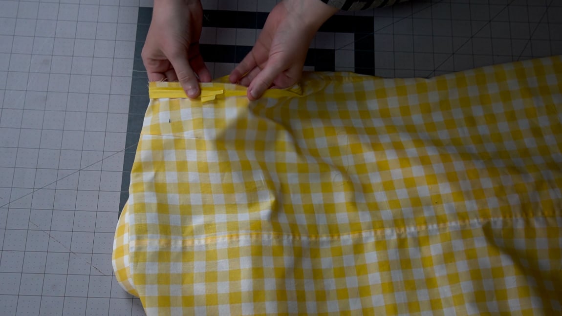 sew bias tape to the right side of armhole