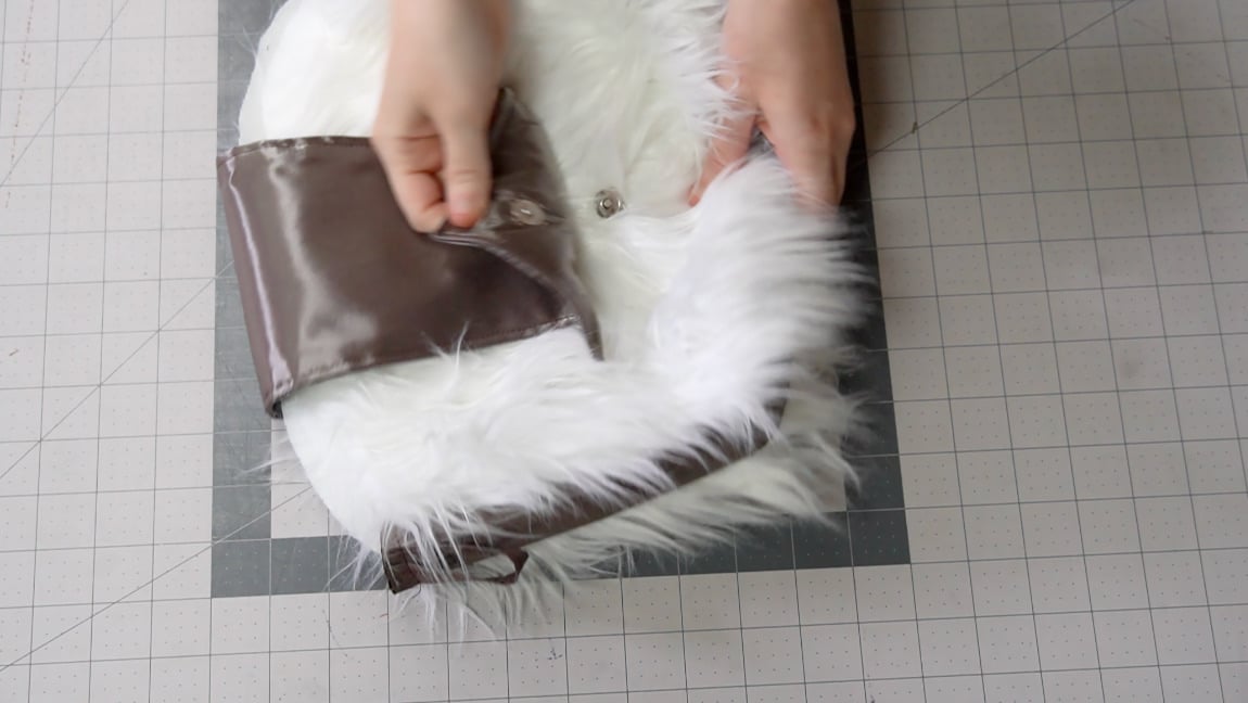 fold arrow over to front and add magnet to the bag