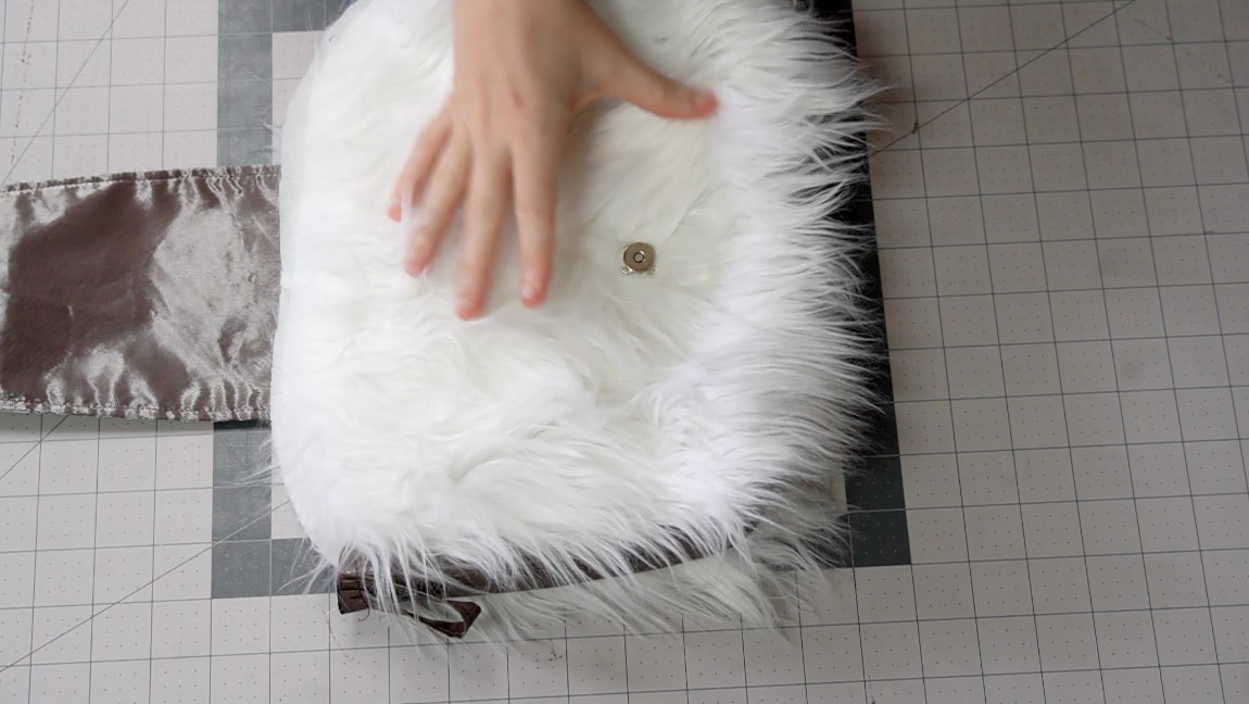 fold arrow over to front and add magnet to the bag