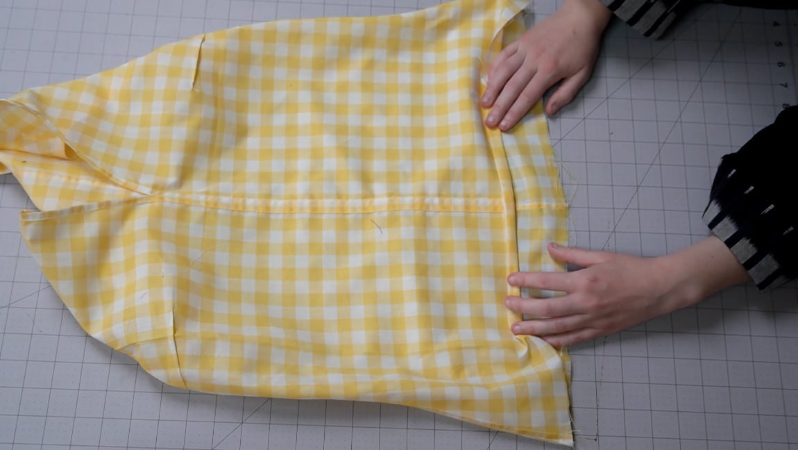 hem the bottom of the shirt