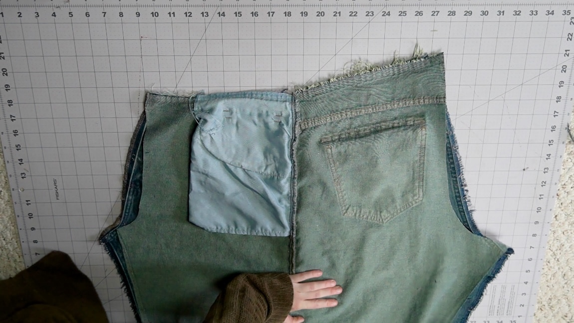 place the cut jeans on top of the other side and cut the crotch line