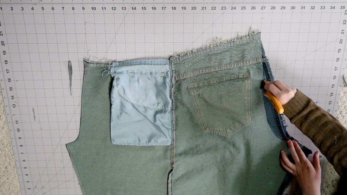 place the cut jeans on top of the other side and cut the crotch line