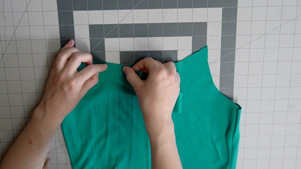 sew the top binding, stretching as you go