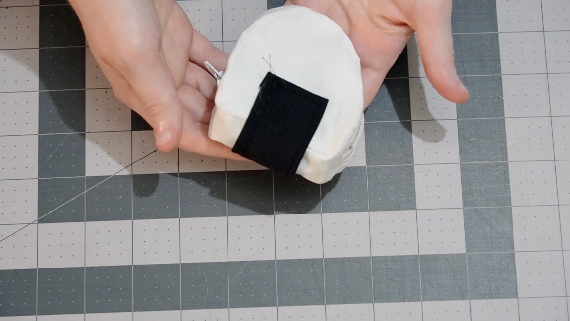 sew the nori to the onigiri base