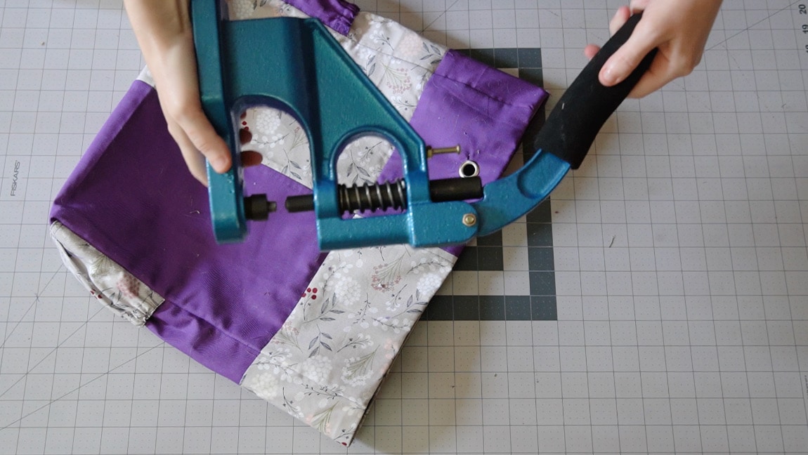 press grommets in place