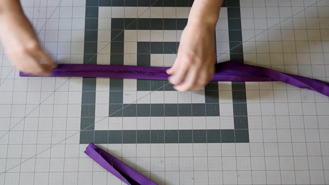 fold straps in quarters and half