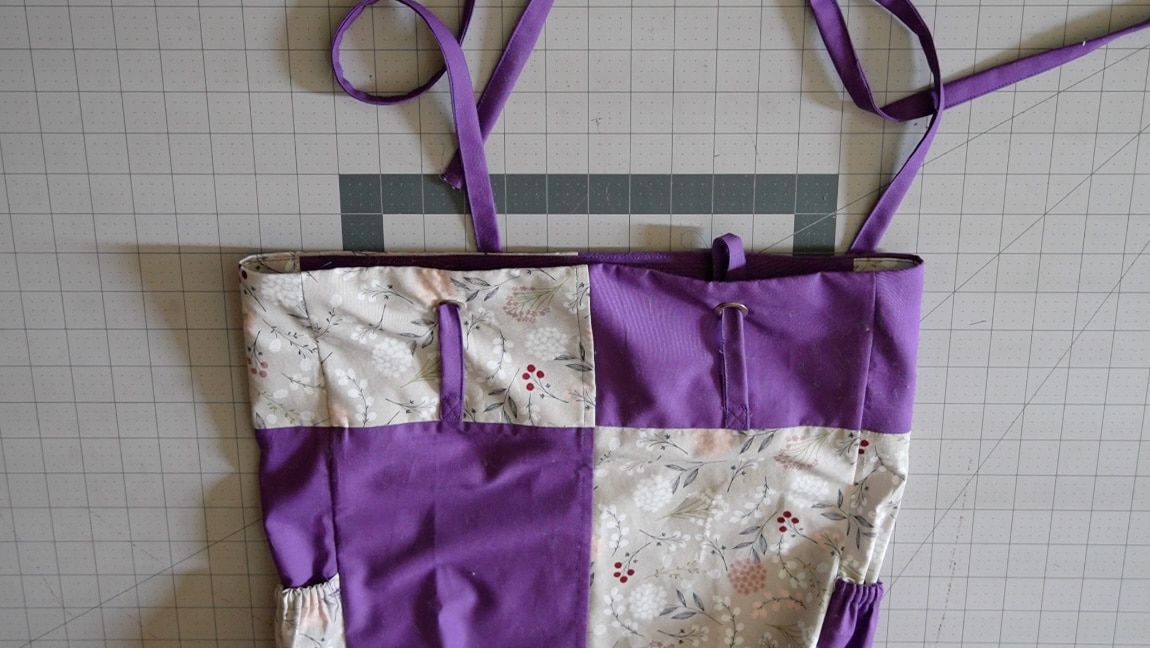 insert straps through grommets